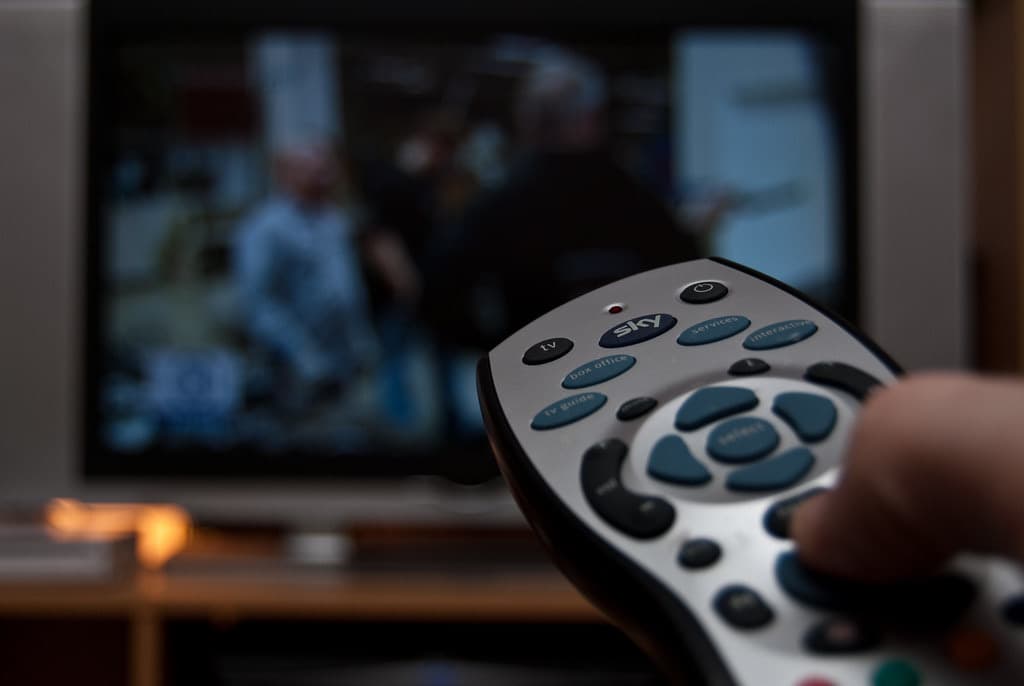 Remote control pointed at a television