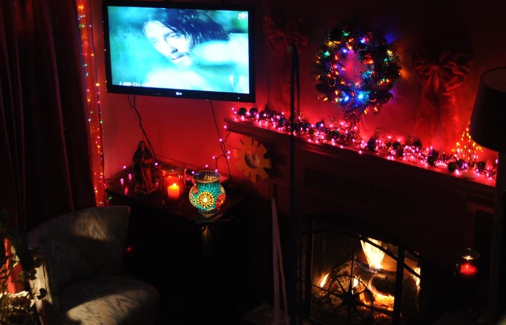 Television on the wall of a cosy living room